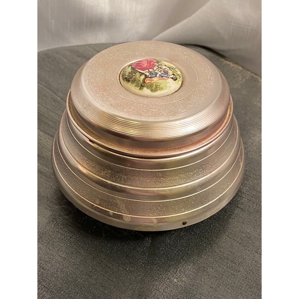 Aluminum Powder Puff Music Box with Colonial Lovers on Ceramic top Medallion EUC